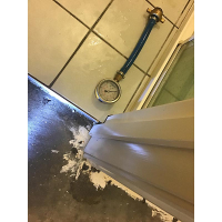 Water damage to the wooden door frame as a result of a leaking shower screen in Downer Canberra